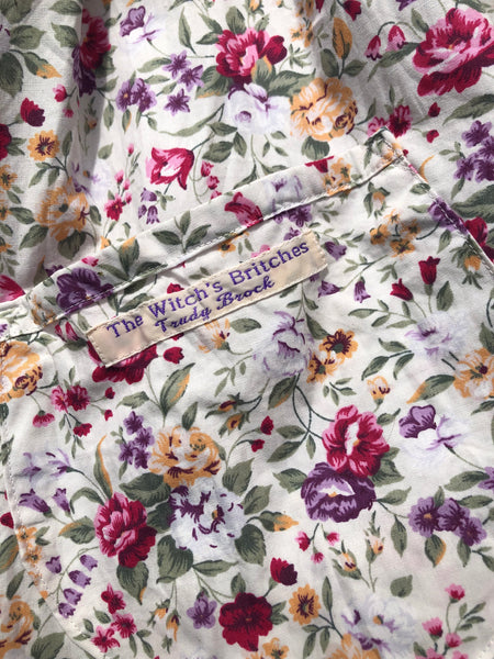 Purple floral print on cream cotton women’s pinafore dress (46” bust)