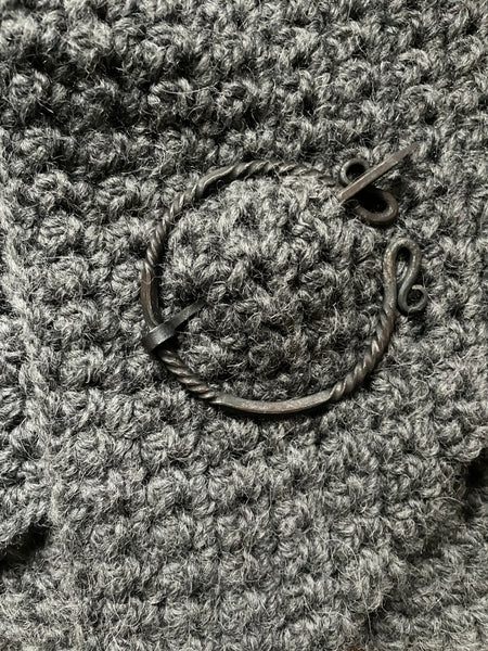 Grey hand crocheted pure wool and alpaca shawl with hand forged cloak pin.